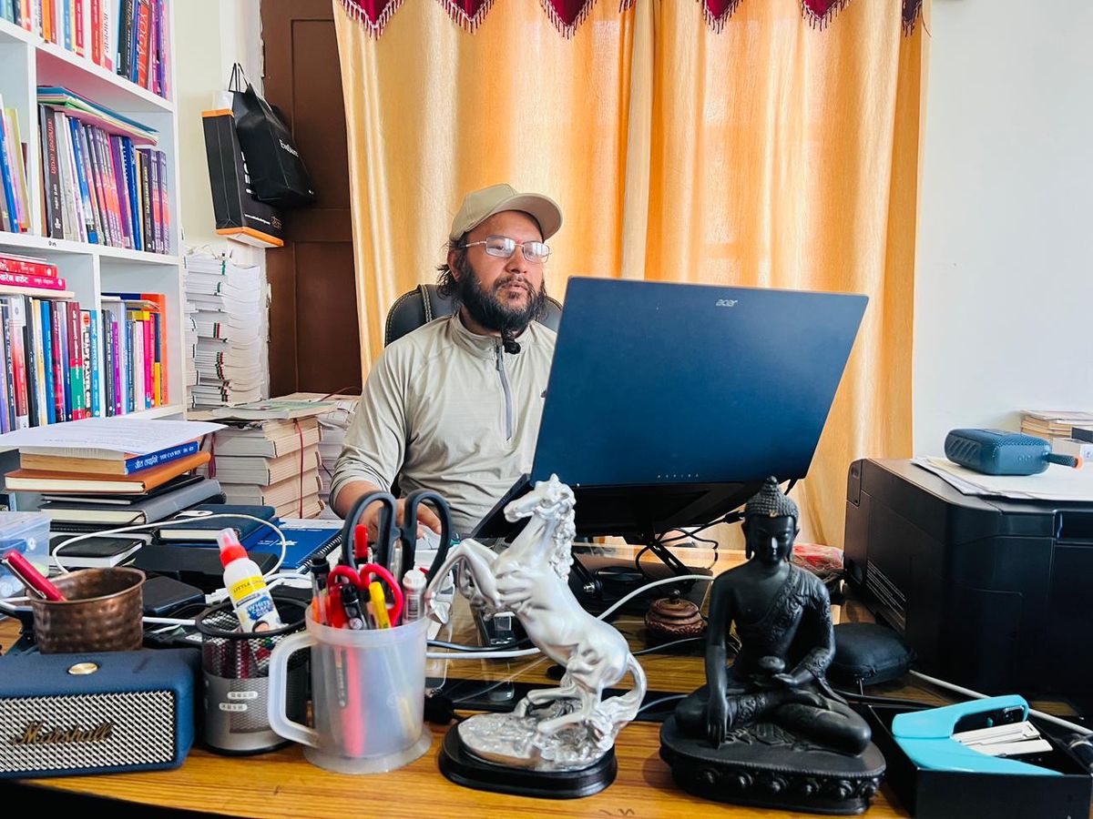 Devraj Pathak at work in his Kathmandu office